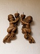 A pair of 
wall-hung 
angels of 
carved wood for 
block lights 
France 18th 
century. Length 
38cm.