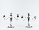 A pair of three armed candlesticks of 830 silver and signed E.T.J.
5000m2 showroom.
