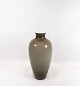 Floor vase of 
brown glass and 
of white 
opaline glass 
on the inside 
by Holmegaard. 
The vase is in 
...