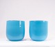 A pair of 
flower pots in 
light blue 
glass by 
Holmegaard. The 
vases are in 
great vintage 
...