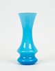 Blue glass vase 
with white 
opaline glass 
on the inside 
by Holmegaard.
14 x 5 cm.