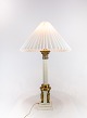 Old french 
Table lamp in 
brass decorated 
with different 
figurines from 
the 1920s. The 
shade is ...