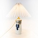 Porcelain table 
lamp by Royal 
Copenhagen with 
number 583/67. 
The shade is 
handpainted and 
hand ...