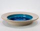 Large ceramic 
bowl with 
turquoise glaze 
by Herman A. 
Kähler.
6 x 32 cm.
