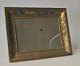 French brass 
photo frame 
with 
decorations. 
20th century 19 
x 24 cm.