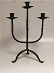 Three-armed 
candlestick 
made of iron 
France 20th 
century 44cm. x 
33cm.