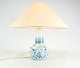 Table lamp in 
blue painted 
porcelain by 
Bing And 
Grøndahl. The 
shade is hand 
folded and hand 
...