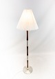 Floor lamp in rosewood and aluminum of danish design from the 1960s. the shade is handfolded and ...