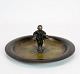 Round dish of 
bronze 
decorated with 
boy figure. The 
dish is in 
great vintage 
condition.