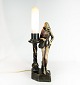 Table lamp of marble decorated with figure.45.5 x 11.5 cm.