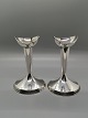A pair of 
Swedish 
candlesticks of 
silver-filled 
Height 13cm.