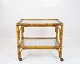 Tray table on 
wheels of 
Bamboo and with 
glass plates. 
The table is in 
great vintage 
condition ...