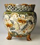 Majolica 
flowerpot 1880 
- 1900. 
Germany. Green, 
brown and light 
decorated with 
rococo patterns 
...