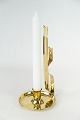 Candlestick of 
brass in Jugend 
style from the 
1920s.
22 x 11 cm.
