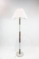 Floor lamp in metal and rosewood of danish design from the 1960s. The shade is hand folded and ...