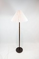Floor lamp in rosewood of danish design from the 1960s. The shade is hand folded and hand ...