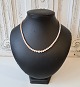Cultured pearl 
necklace with 
clasp in 14 kt 
gold adorned 
with pearl in 
agate. 
Pearl pearl 
...