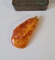 Large polished 
lump of amber 
with the eyelet 
in 14 kt gold 
Appears 
without a stamp 
but has ...