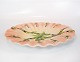 Large plate in 
light colors of 
Italian 
porcelain. 
5.5 x 44 x 35 
cm.
