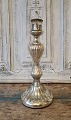 1800s 
candlestick in 
mercuri silver. 

Height 29.5 
cm.