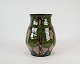 Keramik vase dekoreret med blomster af Danico.
5000m2 udstilling.
