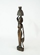 African figure 
in the form of 
a woman made of 
rosewood.
Dimensions: H: 
33.5 cm.
