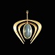 14k Gold 
Pendant with 
Moonstone.
Stamped with 
585.
5 x 4,3 cm. / 
1,97 x 1,69 
inches.
Weight ...