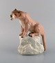 Amphora, Czechoslovakia. Hand painted porcelain figurine of lioness on rock. 
1930/40