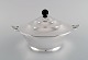 Just Andersen 
for GAB. Rare 
art deco lidded 
bowl in plated 
silver with 
leaf-shaped 
handles. ...