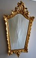 Gilded Danish 
mirror, 
nyrococo style, 
20th century. 
Decorated with 
rocailles. 
Facet mirror 
...