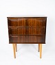 This small 
chest of 
drawers in 
rosewood, 
designed by 
Danish 
craftsmen in 
the 1960s, is a 
...