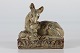 Knud Kyhn 
(1880-1969)
Stoneware 
figurine with 
sung glaze
of a deer with 
her kid model 
no. ...