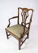 Antique 
armchair of 
light mahogany 
and upholstered 
with green wool 
fabric from the 
1890s.   The 
...