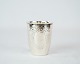 Vase decorated 
with wreath of 
hallmarked 
silver.
6 x 5 cm.