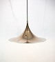 Gold colored 
Gubi Semi 
pendant 
designed by 
Claus Bonderup 
and Thorsten 
Thorup in 1968. 
The ...