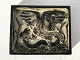 Royal 
Copenhagen 
#21719, Relief 
med slange og 
ørn, 22cm bred, 
17,5cm høj, 
Design Knud 
Kyhn ...