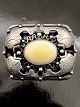 Art nouveau 
sterling silver 
brooch 4.5 x 
3.3 cm. with 
cabochon 
polished ivory 
no. 449148