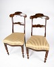 A set of dining 
room chairs of 
mahogany and 
upholstered 
with striped 
fabric from the 
1860s. The ...