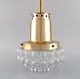 Helena Tynell (b. 1918, d. 2016) for Limburg. Ceiling pendant in clear art glass 
and brass. 1970s.
