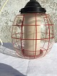 Clear glass 
lamp with red 
stripes and 
white inner 
glass. Measures 
approx. 20x20 
cm