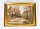 Oil painting 
with motif of 
the forrest in 
the fall and 
gilded frame 
from the 1920s. 

43 x 56 cm.