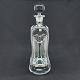 Height 32 cm.
Kluk flask in 
clear glass 
with round 
stopper from 
Holmegaard.
The flask is 
one ...