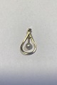 Lund (B.H) 14 
kt Gold Pendant 
with Pearl 
Measures 3 cm/1 
3/16 in Weight 
1.5 gr0.05 oz