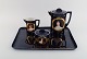 Antique coffee 
service in 
hand-painted 
porcelain with 
motifs of young 
women in 
profile and 
gold ...