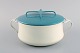 Jens H. 
Quistgaard: Pot 
with lid in 
turquoise and 
cream colored 
enamel. Danish 
design, ...