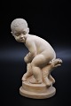 Little Svend 
Lindhart 
terracotta 
figure of child 
with dog. 
The figure is 
signed. 
H:17.5cm.