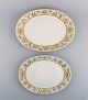 Bjørn Wiinblad 
for Rosenthal. 
Two oval 
serving dishes 
in porcelain 
with gold 
decoration. ...