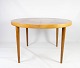 Dining table in 
light wood with 
two extension 
plates, 
designed by 
Omann Junior  
from the 1960s. 
...