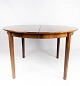 Dining table in 
rosewood with 
three extension 
plates, of 
danish design 
from the 1960s. 
The table ...