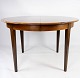 Dining table in 
rosewood with 
two extension 
plates, of 
danish design 
from the 1960s. 
The table ...